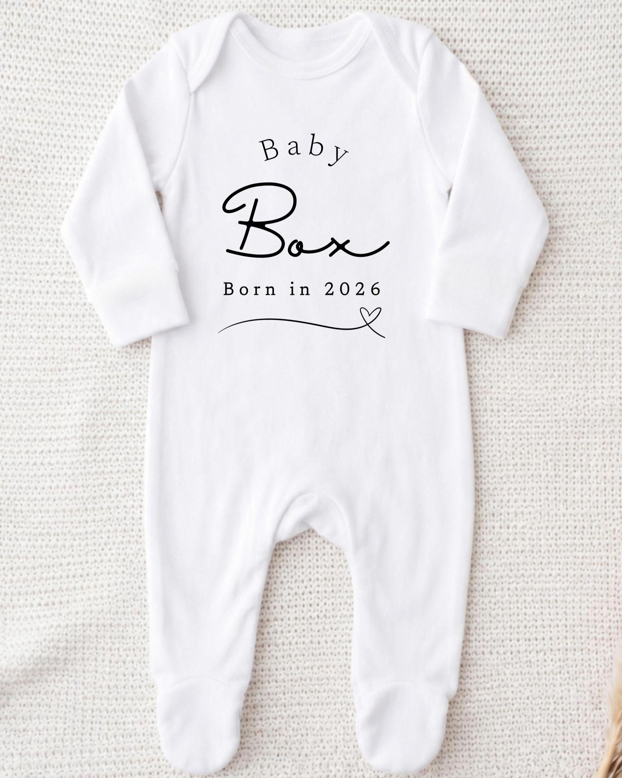 A white onesie with the text "Baby Box" printed on it.