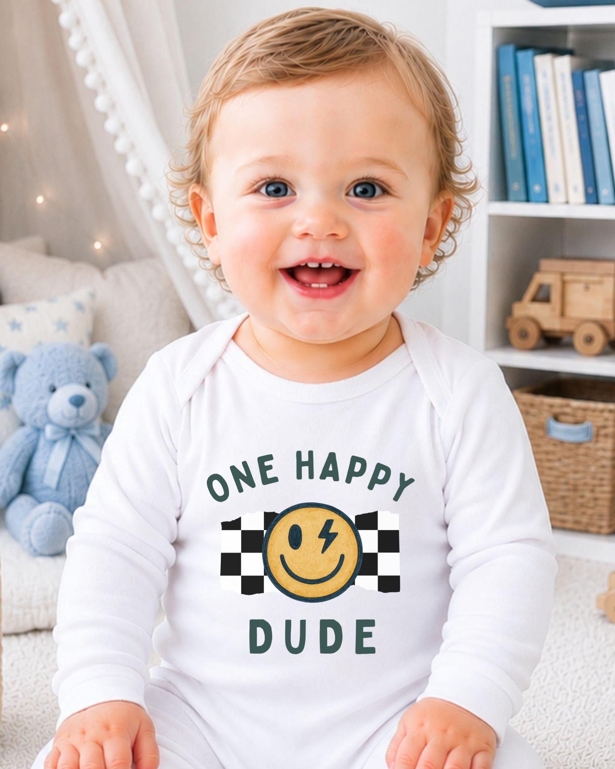 A smiling baby wearing a white onesie with a happy face and the text "One happy dude" printed on it.