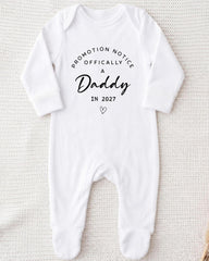 A white onesie with text printed on it.