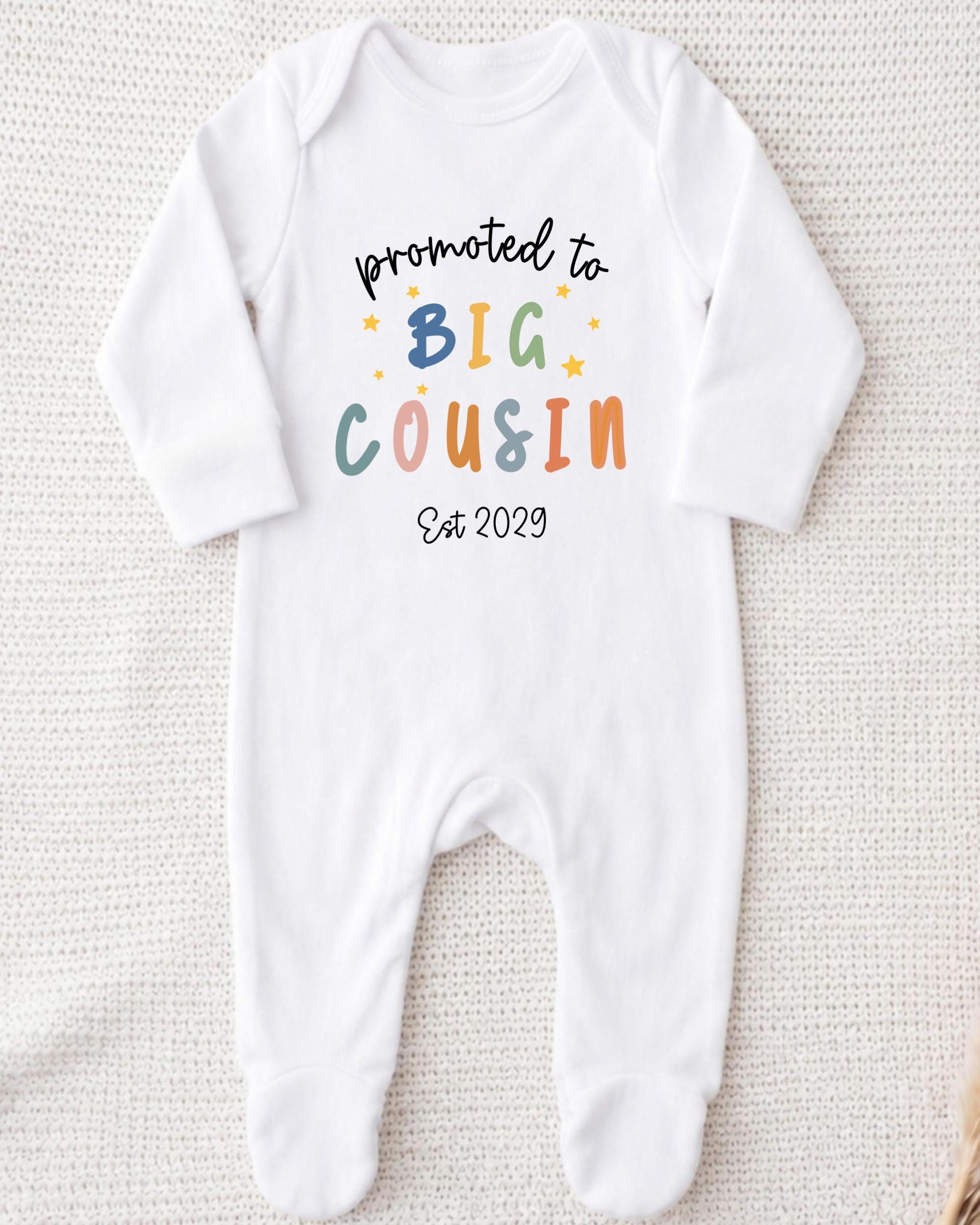 A white onesie with text printed on it.