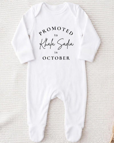 A white bodysuit with text printed on it.
