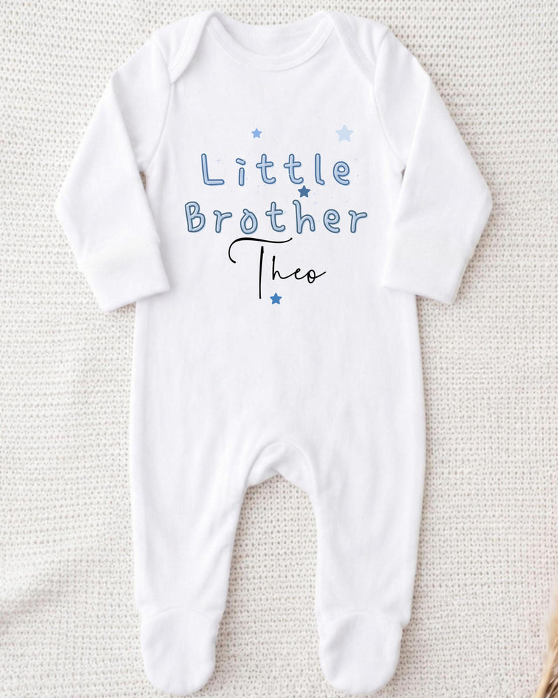 A white onesie with the text "Little Brother Theo" printed on it.