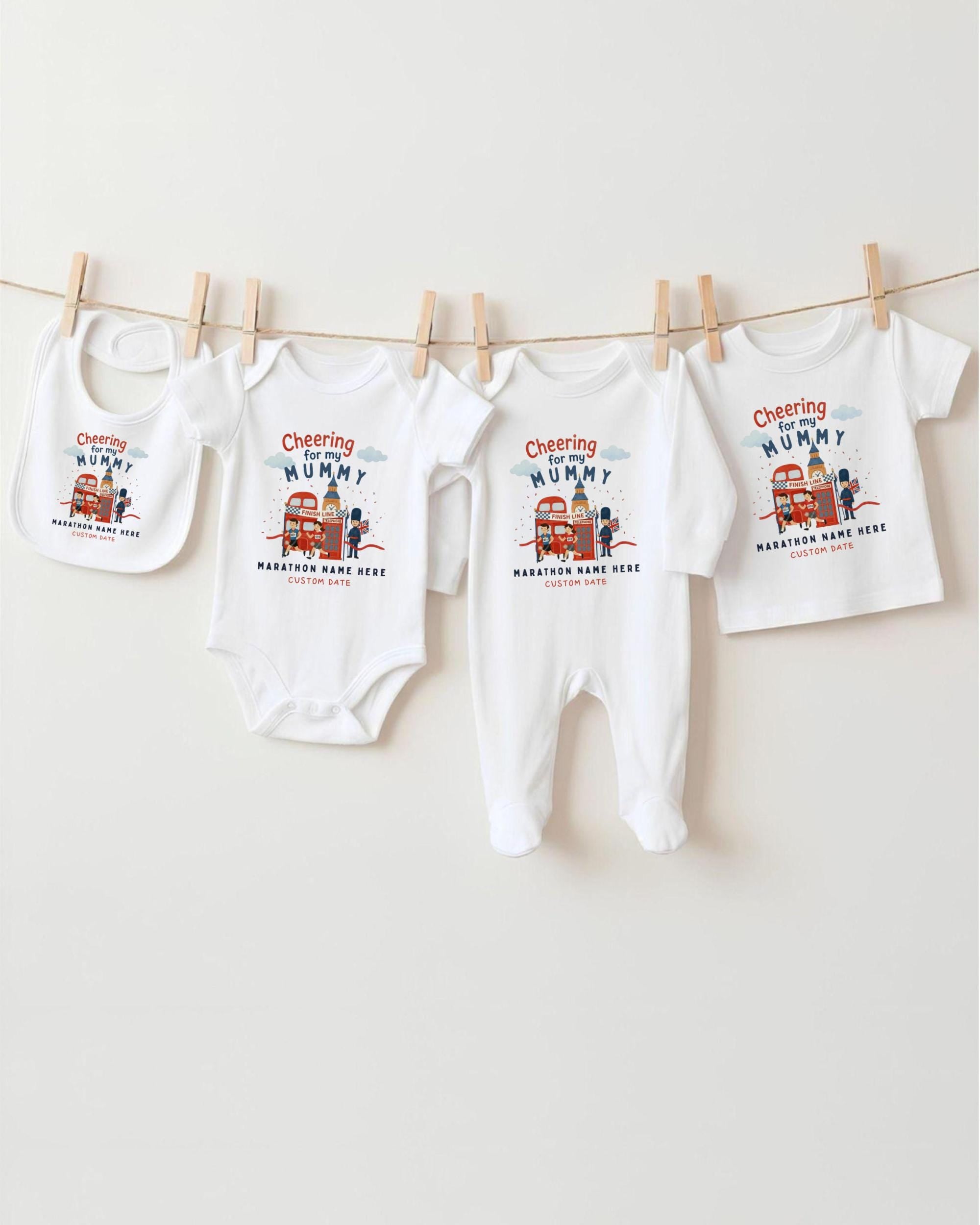 A collection of baby clothes, including onesies and bibs, hanging on a clothesline.