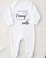 A white onesie with black text that reads "Hand picked by my Nanny in heaven for earth".