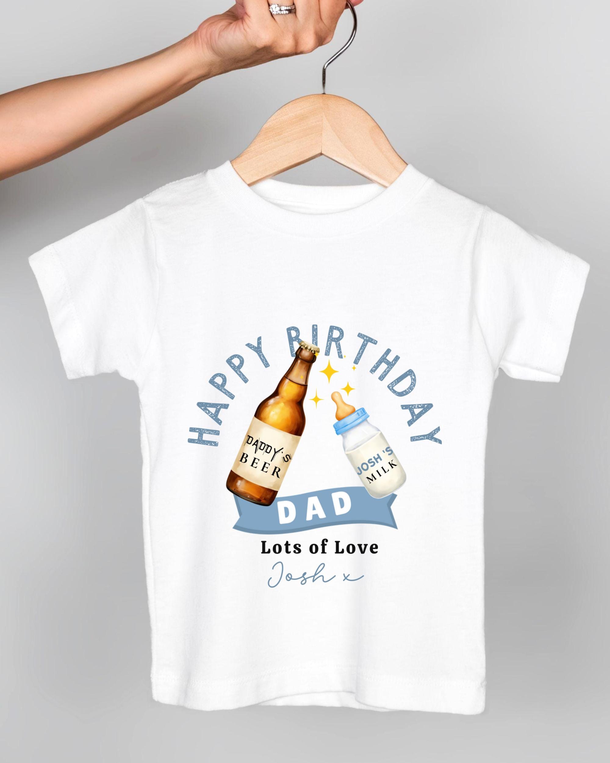 A white t-shirt with a graphic design featuring a beer bottle and a baby bottle, along with the text "Happy Birthday Dad Lots of Love Josh x".