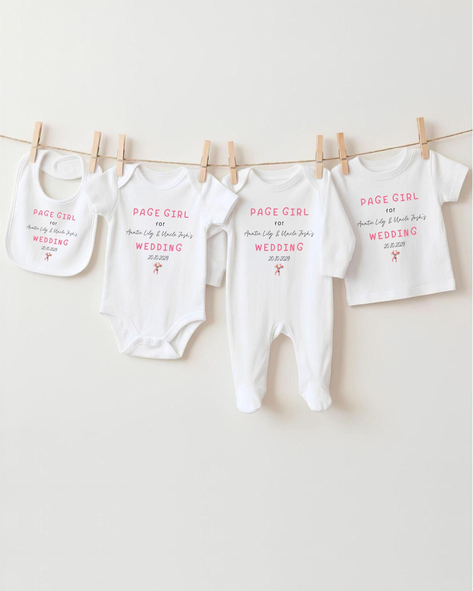 a collection of baby clothes hanging on a clothesline, with each piece featuring a unique design or text.