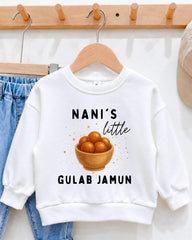 A white sweatshirt with a graphic design and text printed on it, hanging on a wooden hanger.