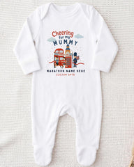 A white onesie with a graphic design on it, featuring a character and text related to a marathon.