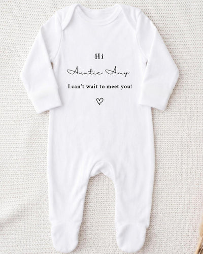 A white bodysuit with a personalized message printed on it.