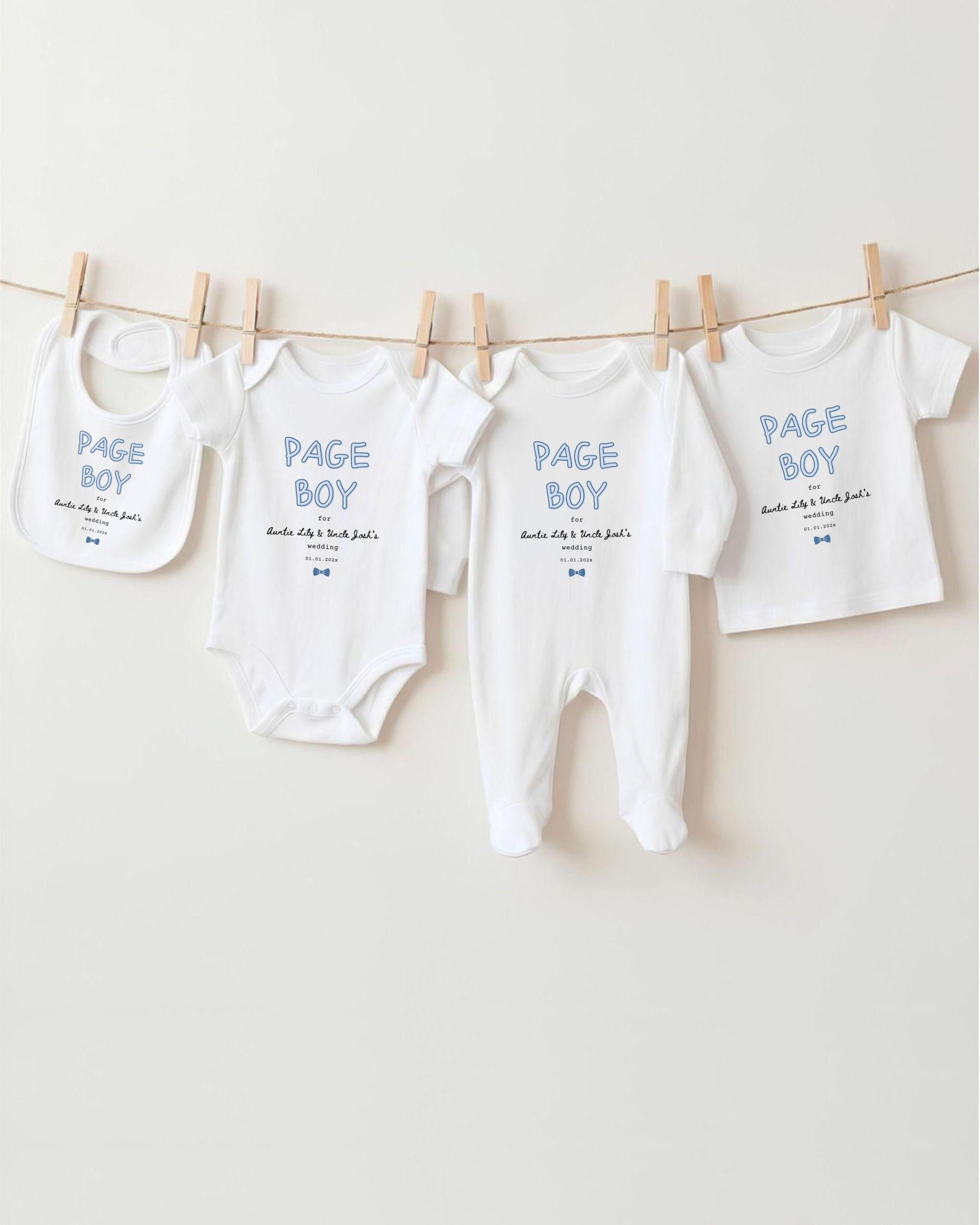 a collection of baby clothes, including onesies and pajamas, hanging on a clothesline.
