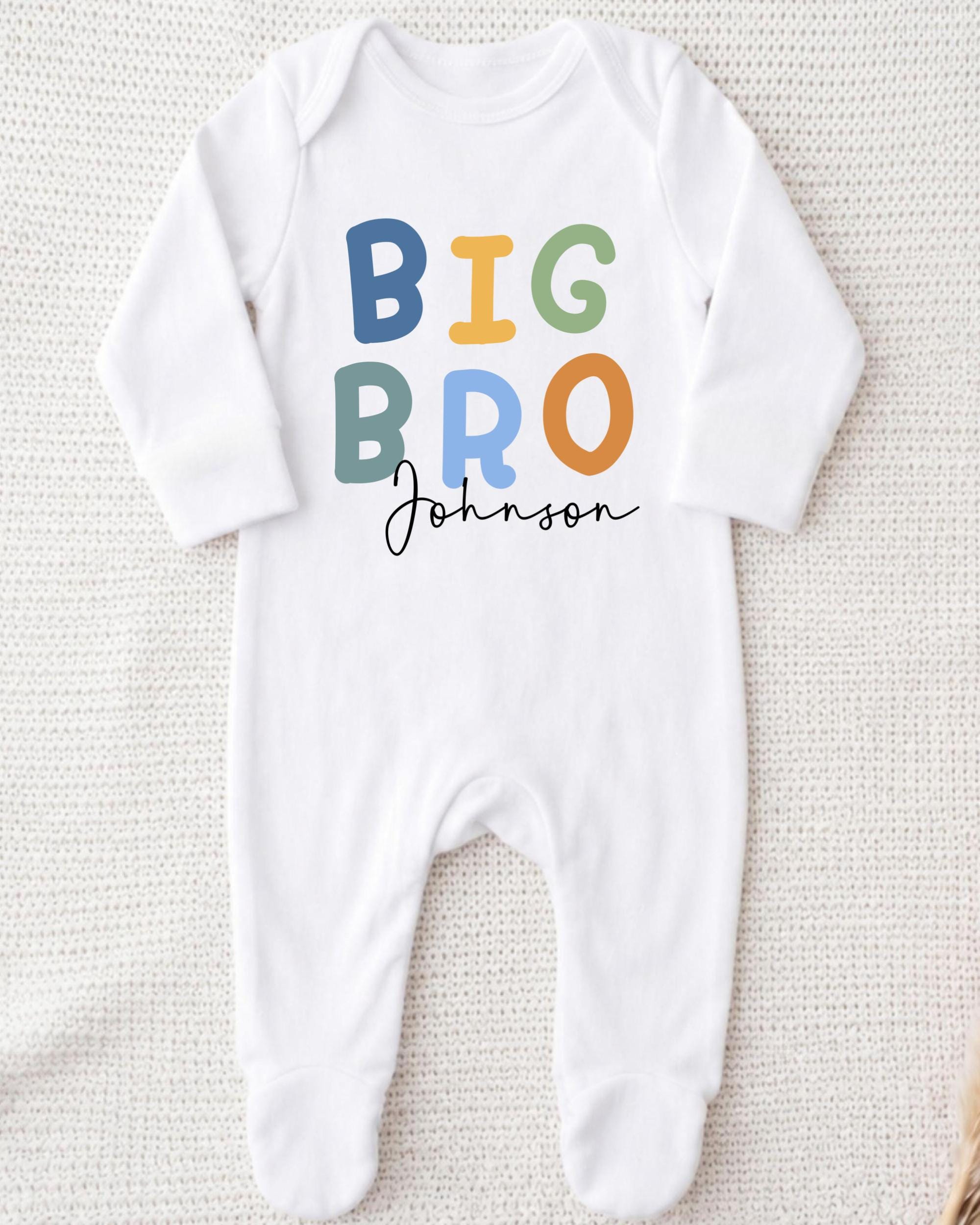 A white onesie with the text "BIG BRO Johnson" printed on it.