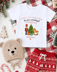 A white t-shirt with a Christmas-themed design, a knitted hat, and a pair of red and white patterned shorts, all surrounded by holiday decorations such as a Christmas tree, ornaments, and a snowflake.