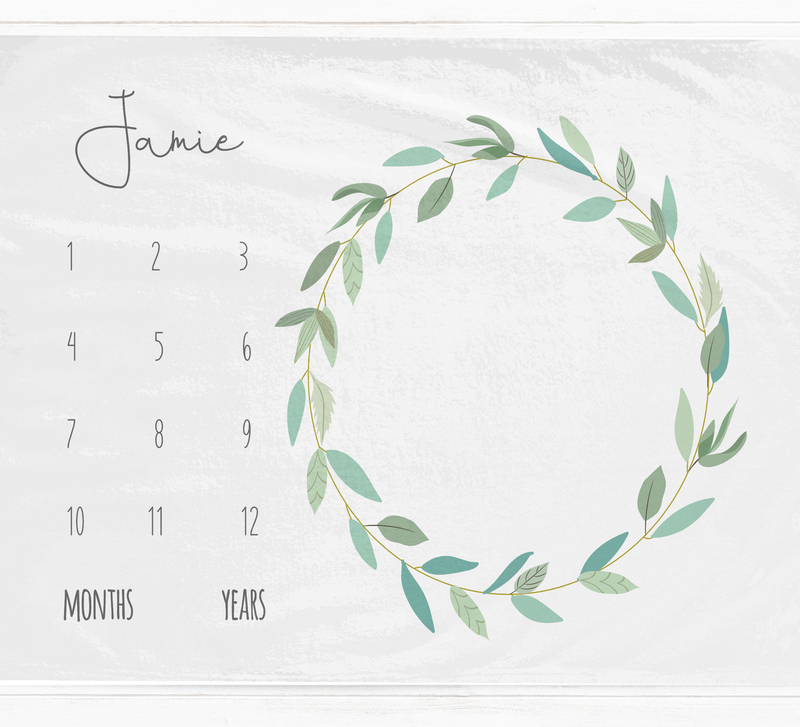 a calendar with a wreath of leaves on it