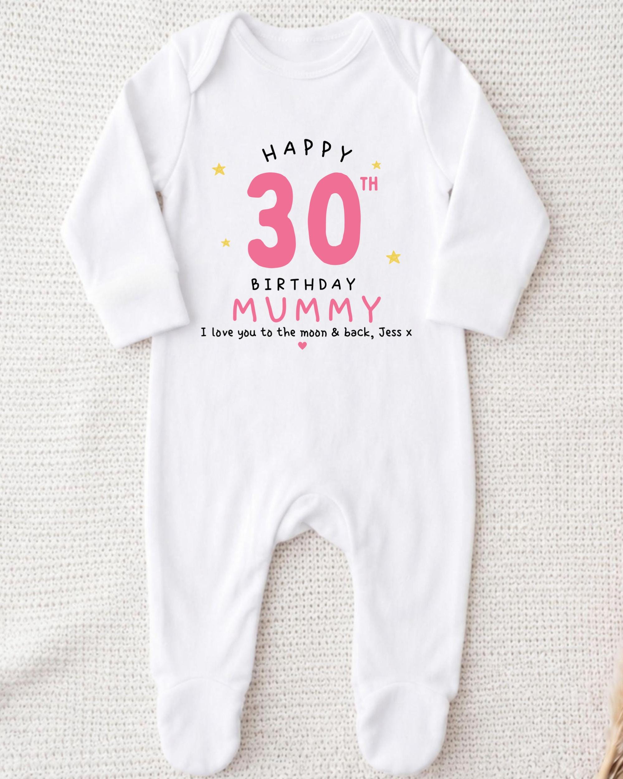 A white onesie with a birthday message printed on it.