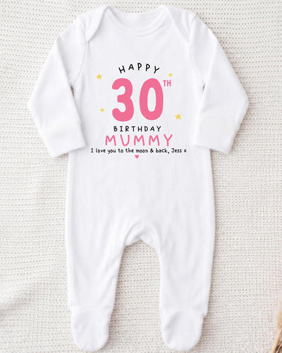 A white onesie with a birthday message printed on it.