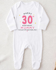 A white onesie with a birthday message printed on it.