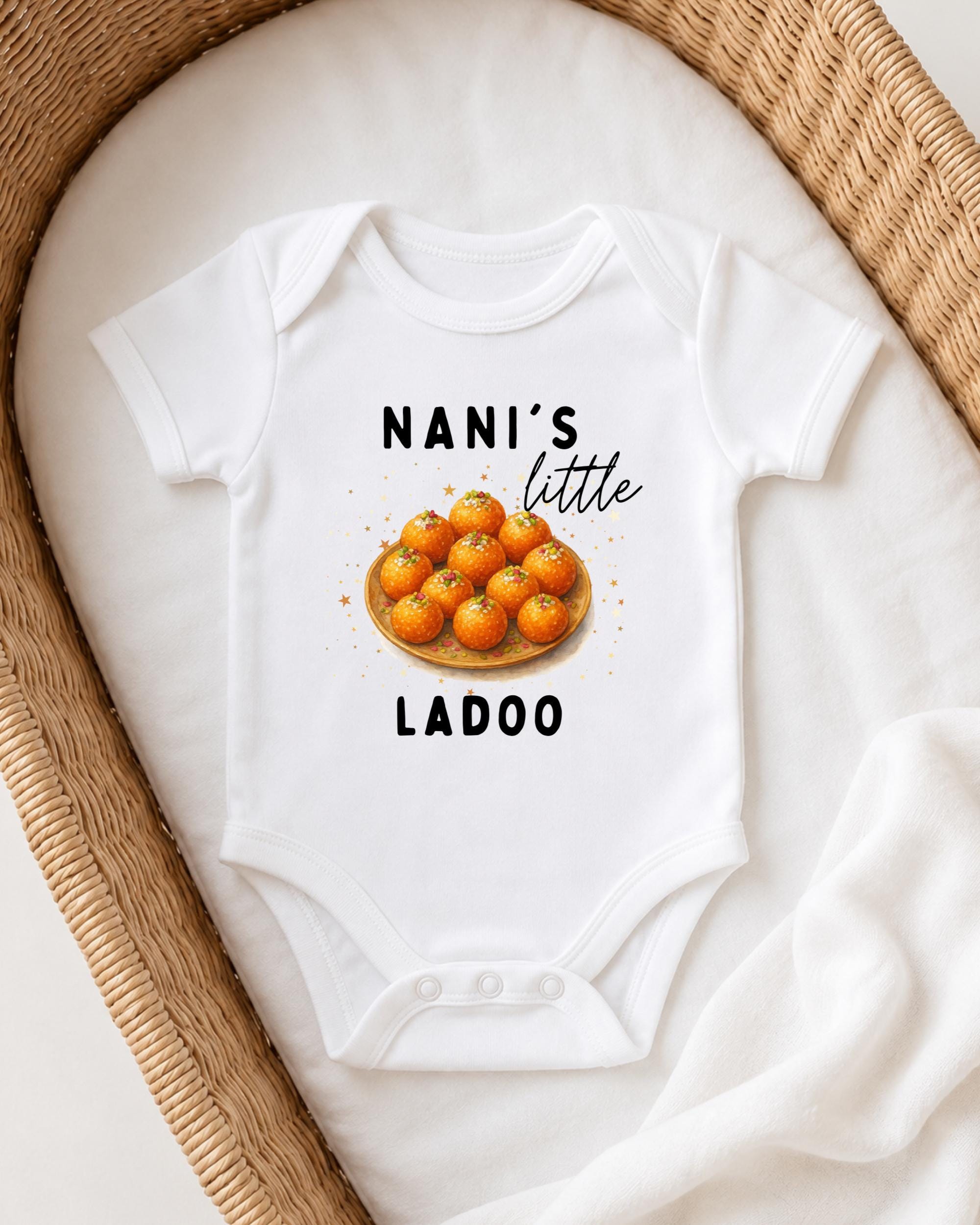 A white onesie with a graphic of oranges and the text "NANI'S LITTLE LADOO" printed on it.