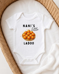A white onesie with a graphic of oranges and the text "NANI'S LITTLE LADOO" printed on it.