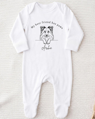 A white bodysuit with a black and white illustration of a dog's face and the text "My best friend has paws" printed on it.