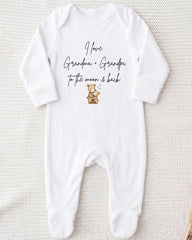 A white onesie with text and an illustration of a teddy bear.
