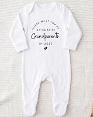 A white onesie with text on it, placed on a white background.