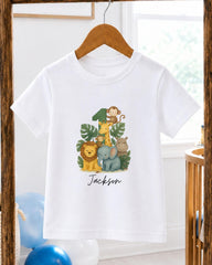 A white t-shirt with a cartoon illustration of various animals, including a monkey, lion, and elephant, along with the text "Jackson" printed on it.
