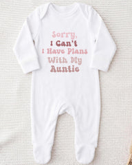 A white onesie with text printed on it.