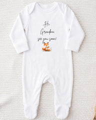A white onesie with a cute cartoon fox and the text "Hi Grandma, see you soon!" printed on it.
