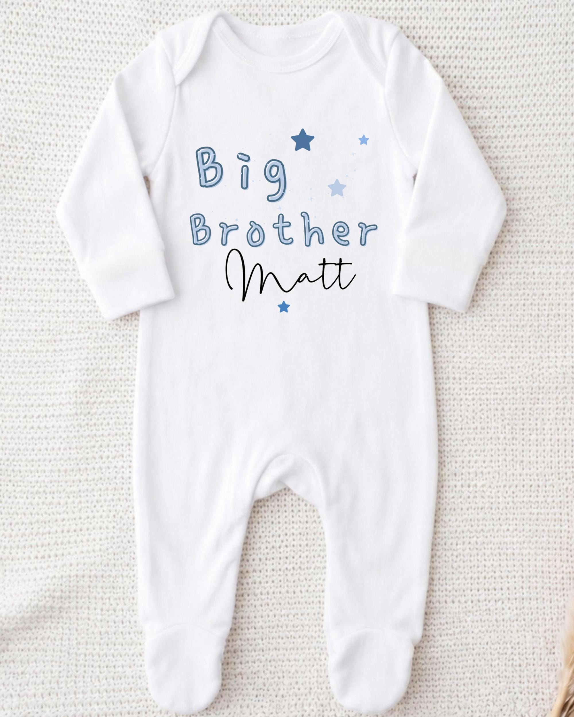 A white onesie with the text "Big Brother Matt" printed on it.