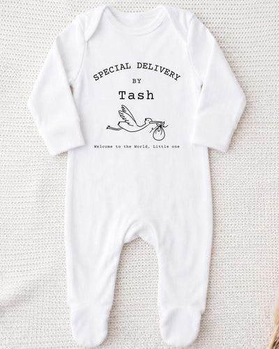 A white bodysuit with text and a graphic of a baby swan.