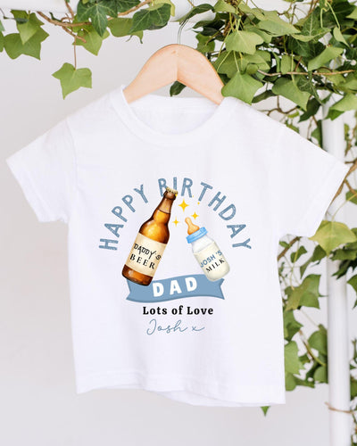 A white t-shirt with a graphic design featuring a bottle of beer and a baby bottle, along with the text "Happy Birthday Dad Lots of Love Josh".